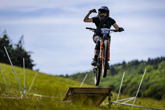 Mountain biker on the trail wearing MTB goggles with a helmet, showing how goggles, helmet and lens choice work together